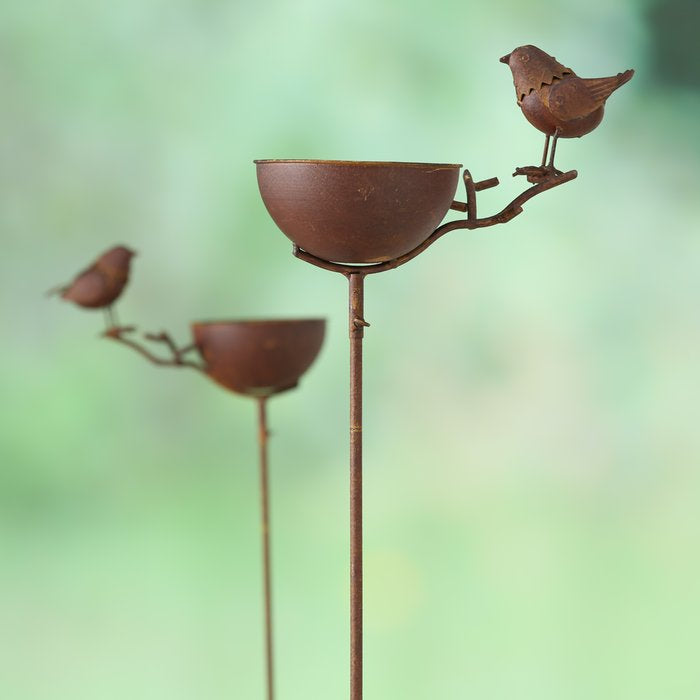 Rust coloured metal bird bath