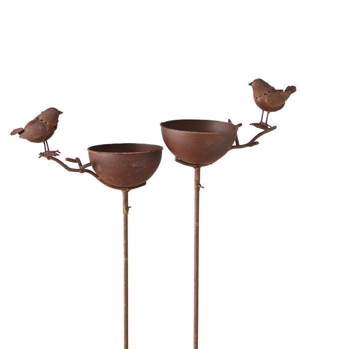 Rust coloured metal bird bath