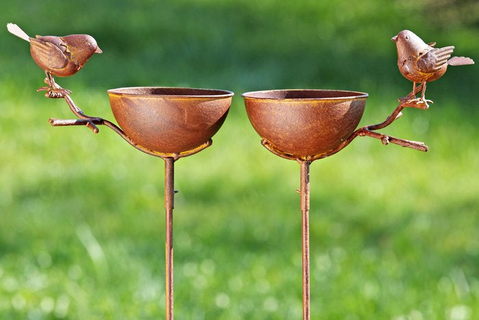 Rust coloured metal bird bath