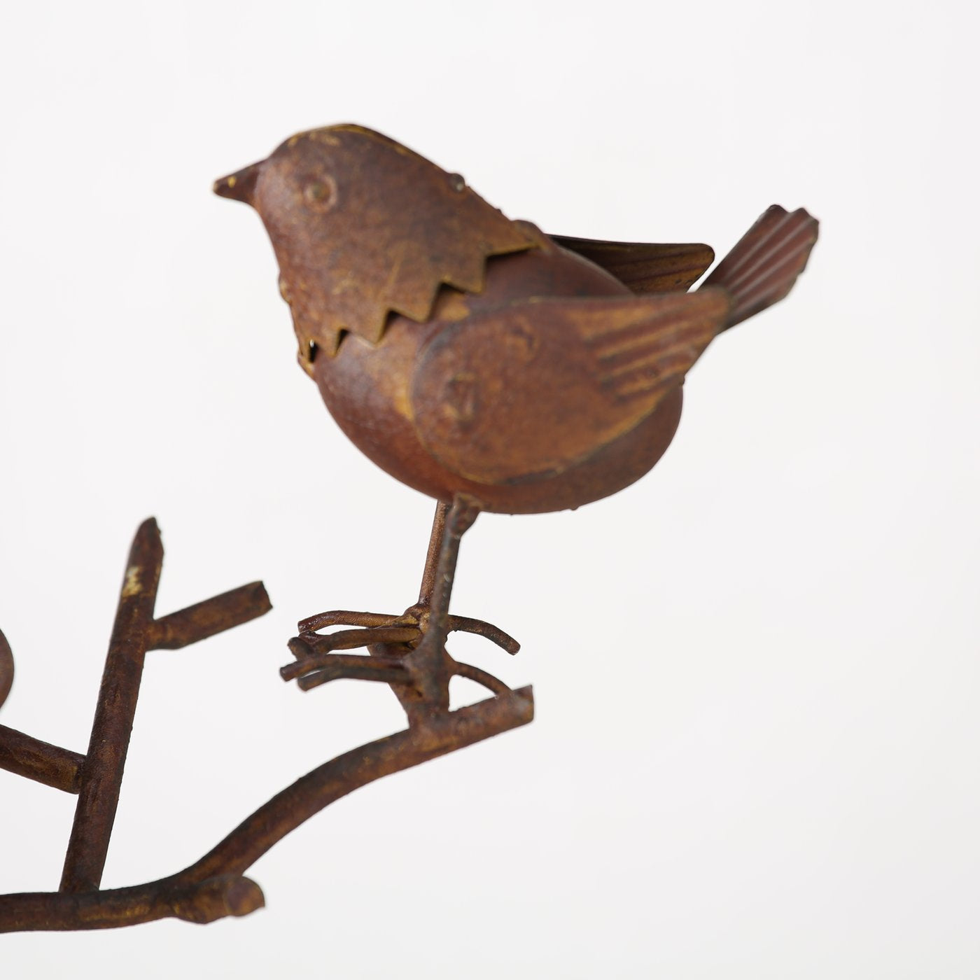 Rust coloured metal bird bath