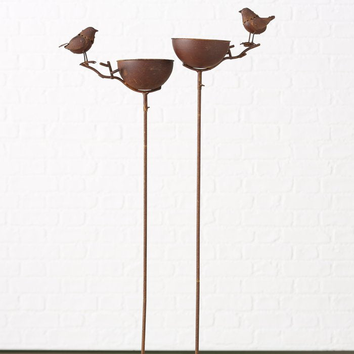 Rust coloured metal bird bath