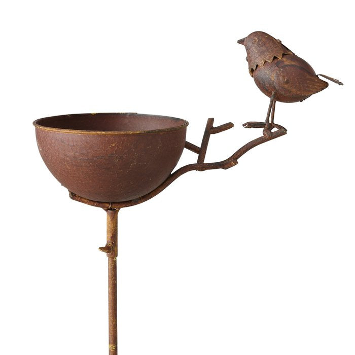 Rust coloured metal bird bath