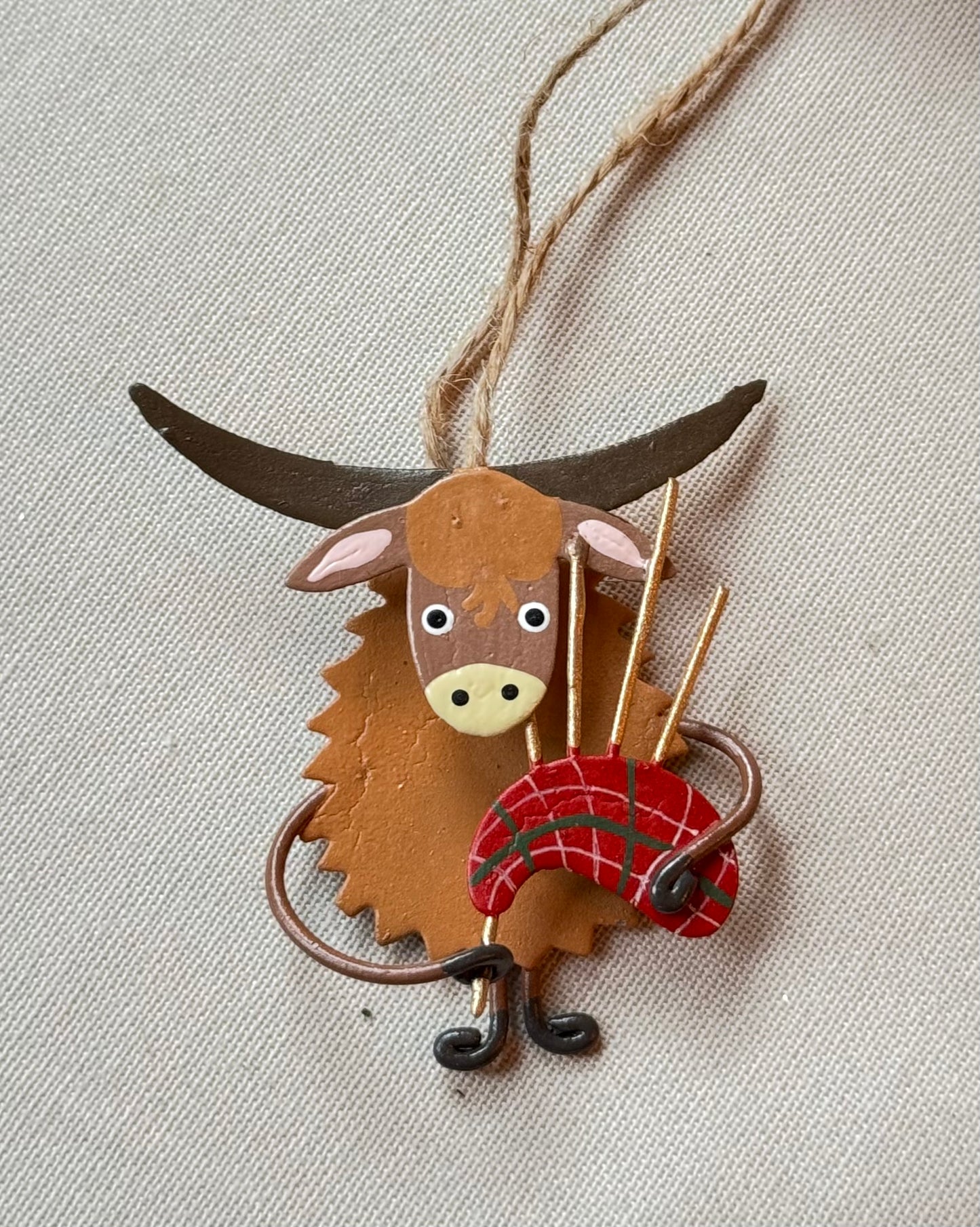 Scottish gift - Highland cow with bagpipes - hanging or standing block